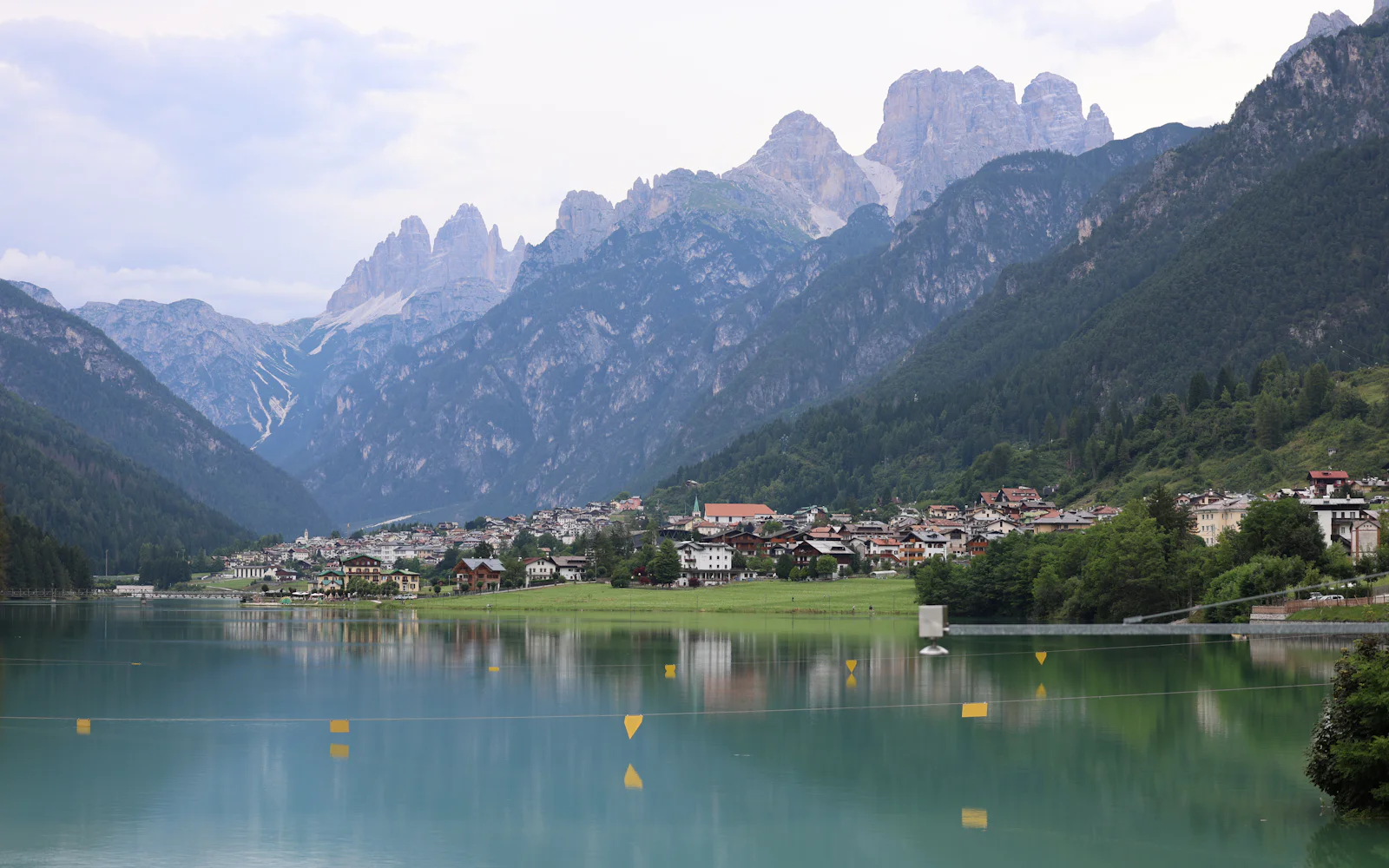 A mountain lake below pale Dolomite peaks