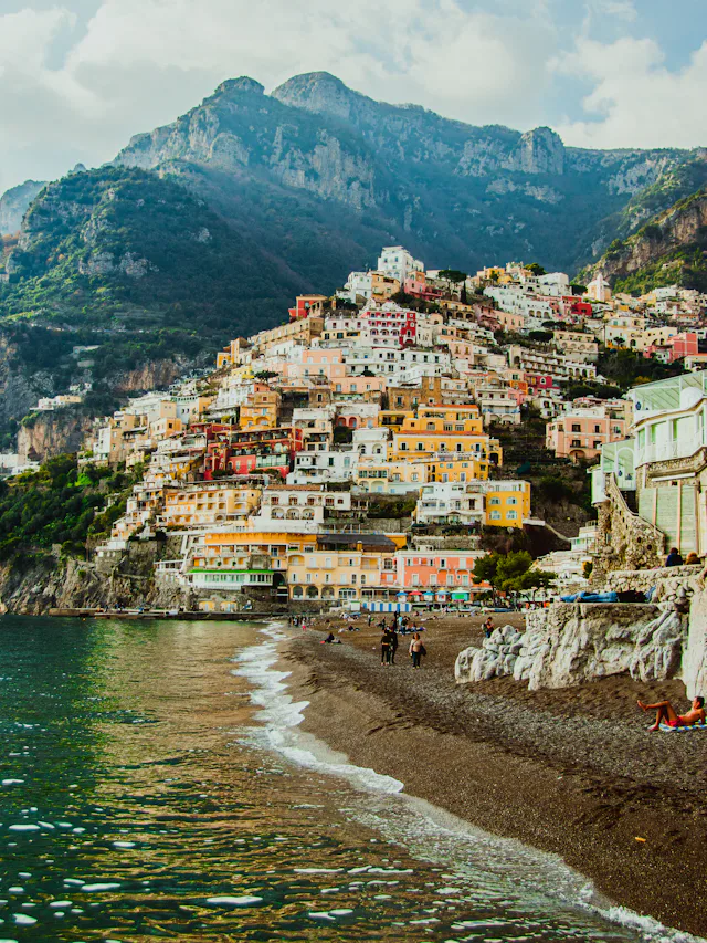 Positano's pastel houses tumbling down to a beach of umbrellas